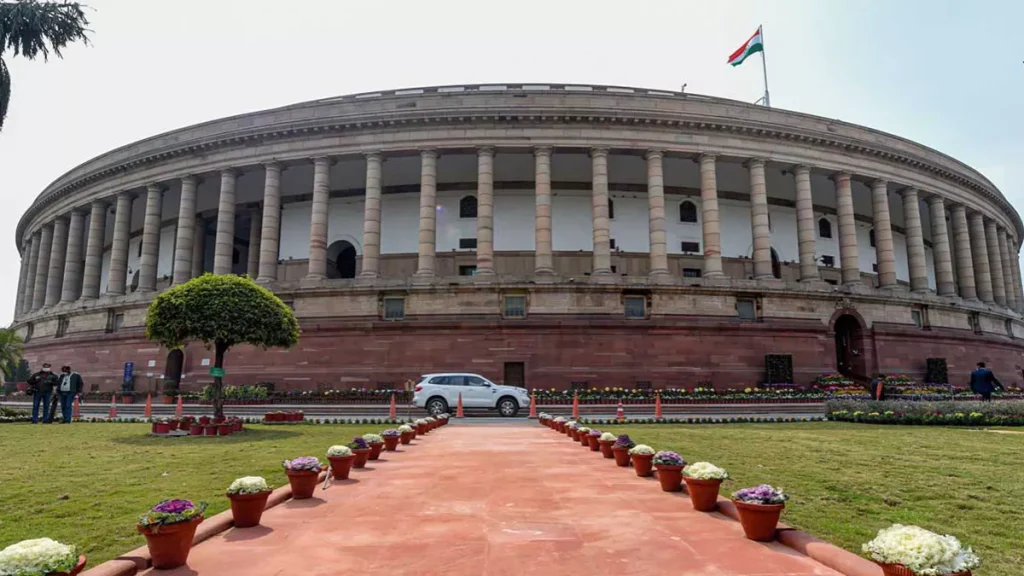 Image of Indian Parliament building with text: 'MP Salary and Perks'